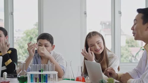 Students with Science Teacher Learning in Classroom