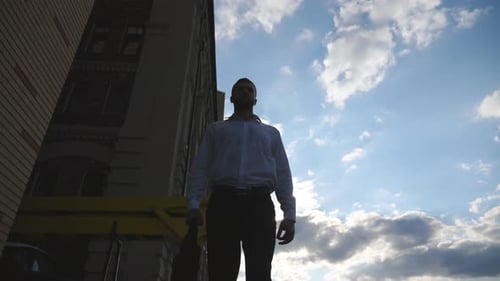 Man Stands Tall in the City Downtown