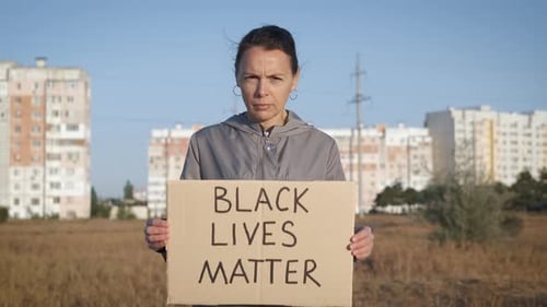 Woman Holds Black Lives Matter Sign