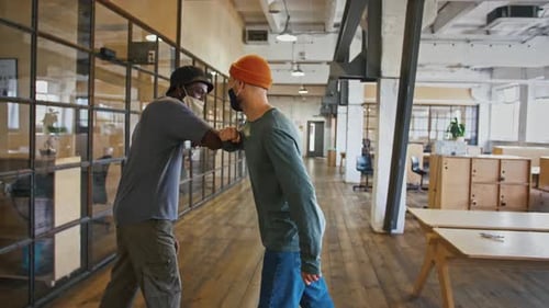 Workplace Greeting with Elbow Bump During Pandemic