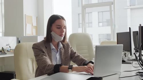 Businesswoman Working in Office during Pandemic