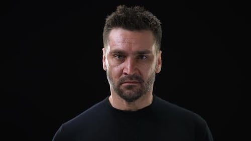 Man Screaming in Anger and Frustration on Black