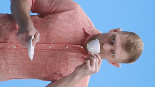 Bearded Man Enjoying a Cup of Coffee