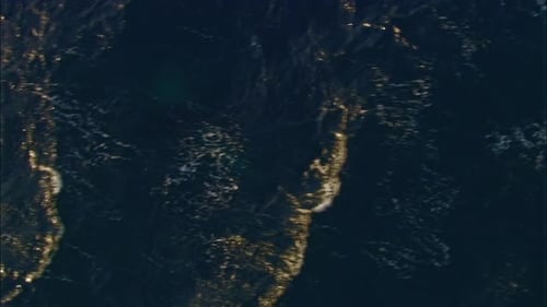 Aerial View of Whale Breaching the Ocean Surface