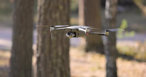 Drone Copter Flying with Digital Camera in Forest