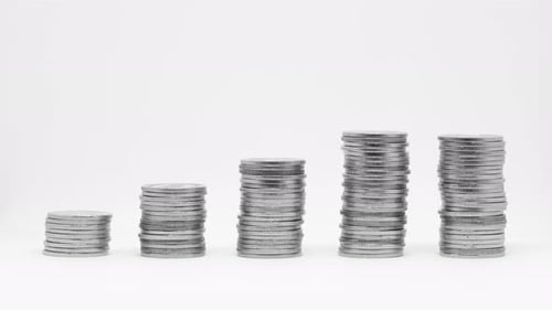 Stacks of Silver Coins Showing Growth
