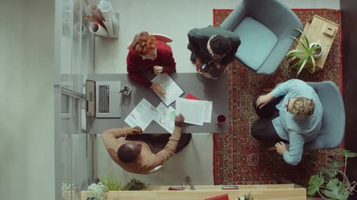 Business People Working on Project and Drinking Coffee in Office