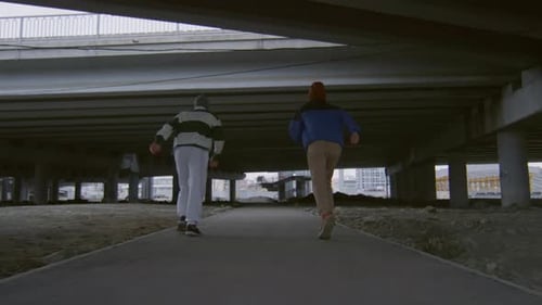 Athletes Gymnastics Tumbling Underneath Urban Bridge