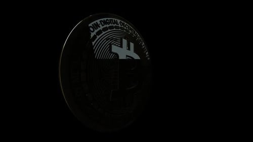 Golden Bitcoin Coin Rotating on Black Background
