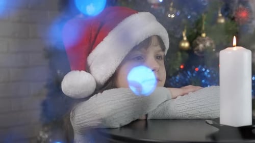 Little Girl Miracle at Christmas Candle at Home