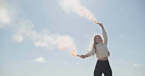 Girl Outdoors With Smoke Flares on Sunny Day