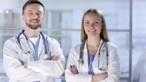 Smiling Doctors Standing Together in Medical Office