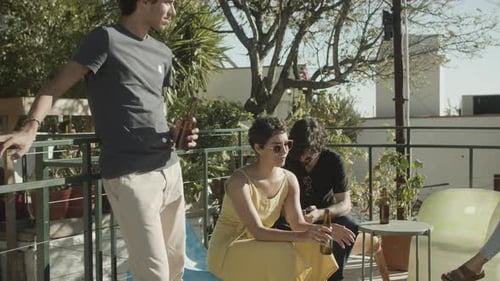 Cheerful Men and Women Talking During Rooftop Party