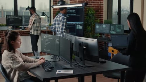 People coding in a modern tech office