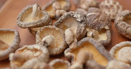 Close Up of Dried Shiitake Mushrooms on Wood