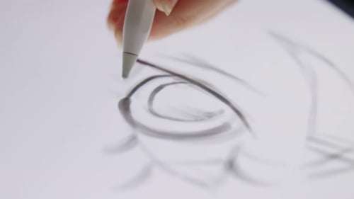 Stylus Sketches Eye on White Surface
