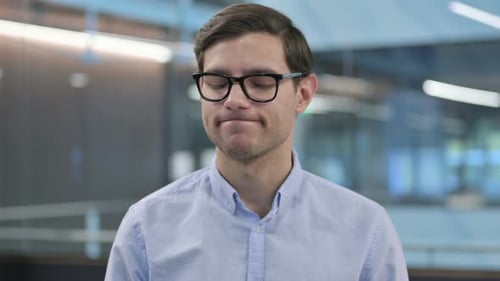 Man Wearing Glasses Looking at the Camera