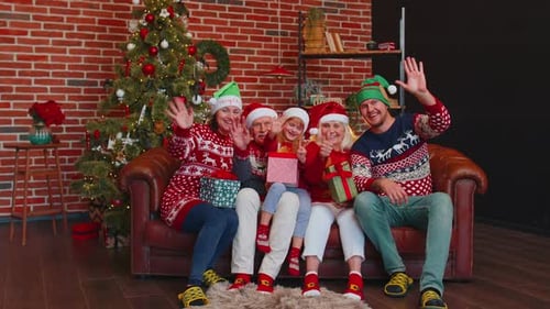 Family Poses for Christmas Photo on Couch