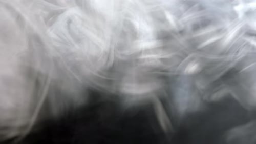 Abstract White Vapor Swirling on Black Background