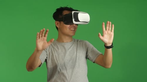 Asian Man Working In Virtual Reality