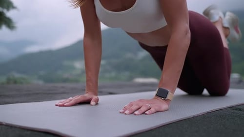 Sexy Young Woman is Doing Pushup Outdoors Workout in Park in Morning