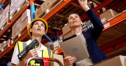 Manager showing something to worker