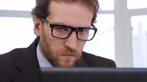 Close Up Of Man Working At Computer