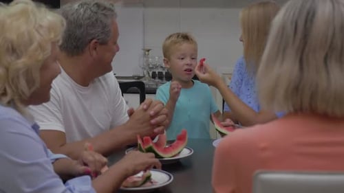 Family Togetherness at Home Enjoying Watermelon