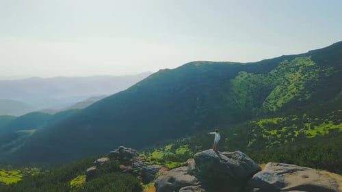 Woman Enjoying Mountain View on a Sunny Day