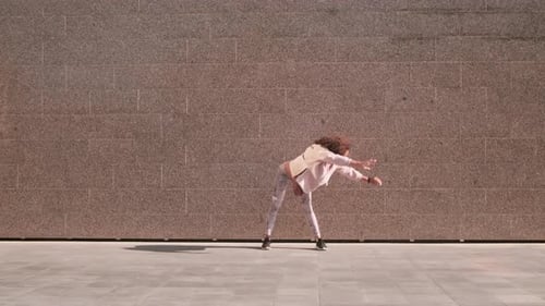Young Woman Stretching Outdoors in an Urban Setting