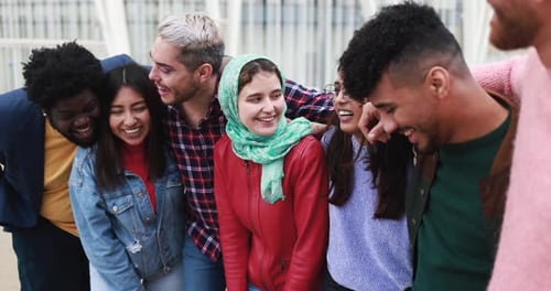 Group of young diverse people having fun outdoor laughing together - Diversity concept