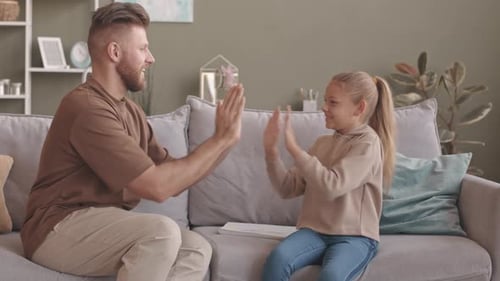 Father and Daughter Play Cheerful Clapping Game