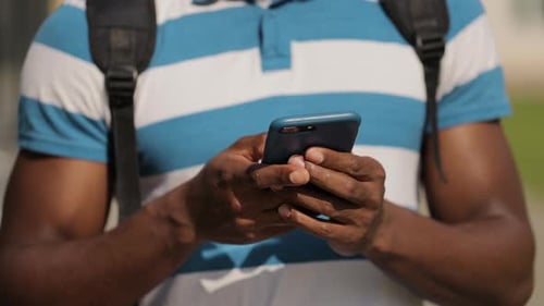 Man Hands Holding Smart Phone in Urban City