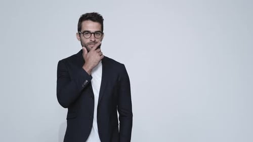 Man with Glasses Posing in Front of White Background