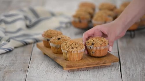 Fresh Blueberry Muffins Placed on Wooden Board
