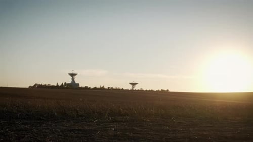 Radio Telescope Silhouetted Against the Setting Sun