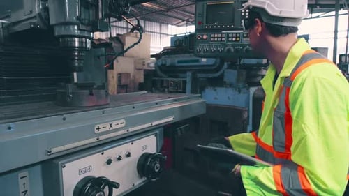 Smart Factory Worker Using Machine in Factory Workshop