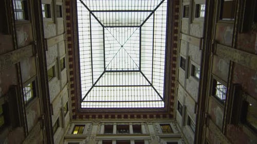 Building's Interior Courtyard Featuring a Glass Roof