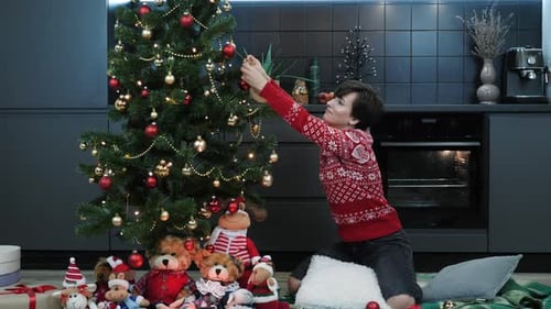 Woman Decorates Christmas Tree at Home