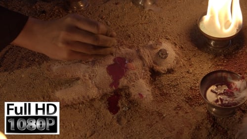 Voodoo Doll Ritual With Red Liquid And Flames