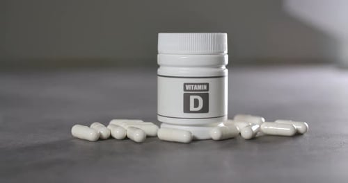 Vitamin D Supplement Bottle with Pills