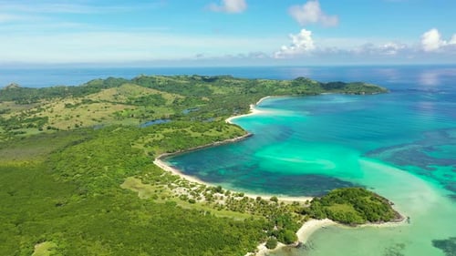 A Tropical Island with a Turquoise Lagoon and a Sandbank