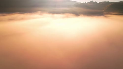 4K Aerial view of the misty sunrise in the forest. Tropical Rainforest in Thailand