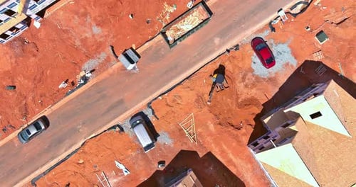 Aerial View of Unfinished House with Wooden Roof Frame Structure Under Construction