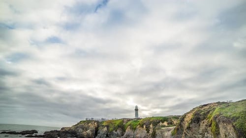Lighthouse Overlooking the Pacific Ocean on California Coast