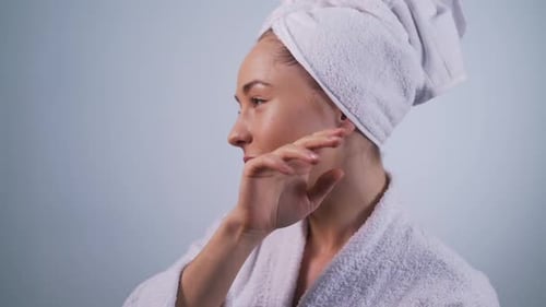 Girl Touches Face After Cosmetic Procedures Close-up