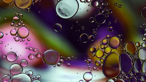 Macro View of Colorful Bubbles Floating and Merging