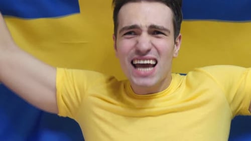 Man Cheering with Flag Close Up