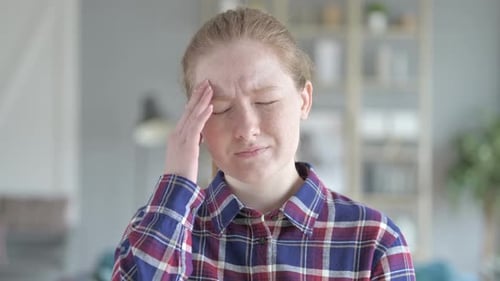 Close Up of Young Woman Having Headache