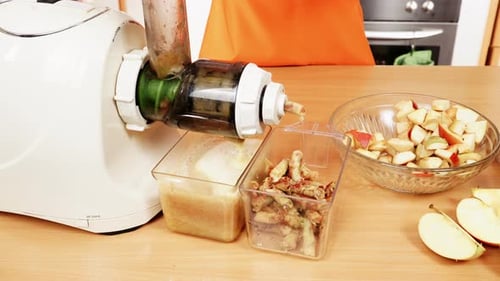 Preparing Fresh Apple Juice with Juicer at Home